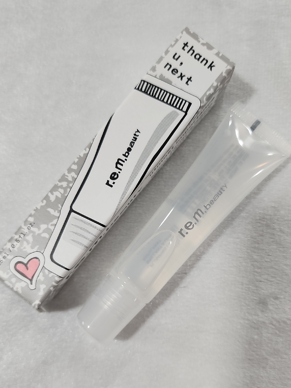 r.e.m. Beauty by Ariana Grande "Thank u, Next" Plumping Lipgloss